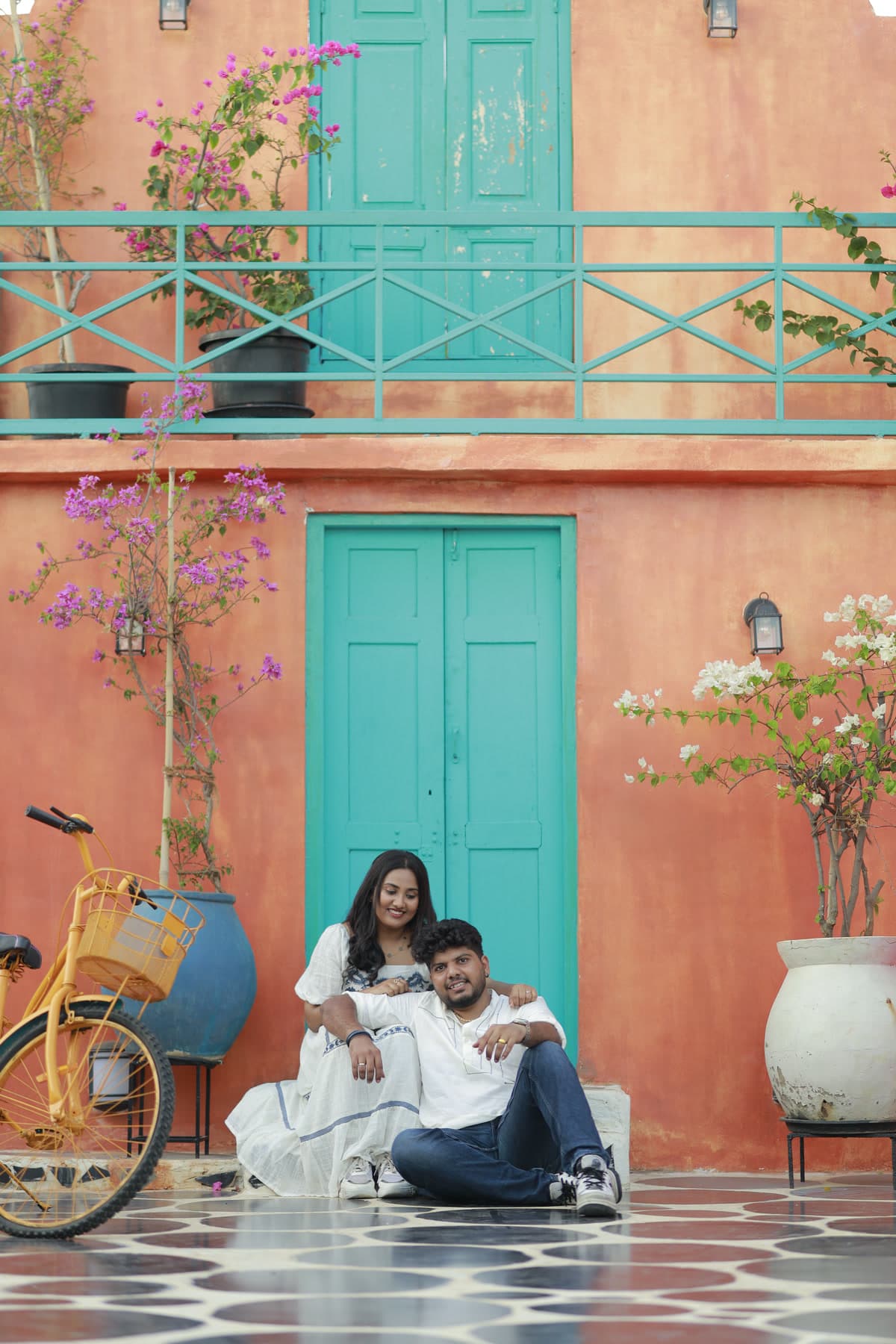 Vintage bicycle parked against an outdoor pastel wall